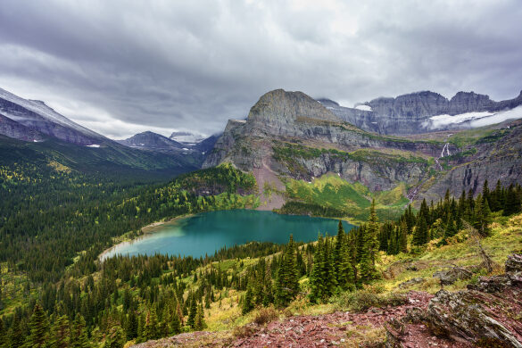 Grinnell Lake and Falls in Glacier National Park under Rain Clouds
