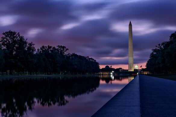 The National Mall turns purple with the rising sun