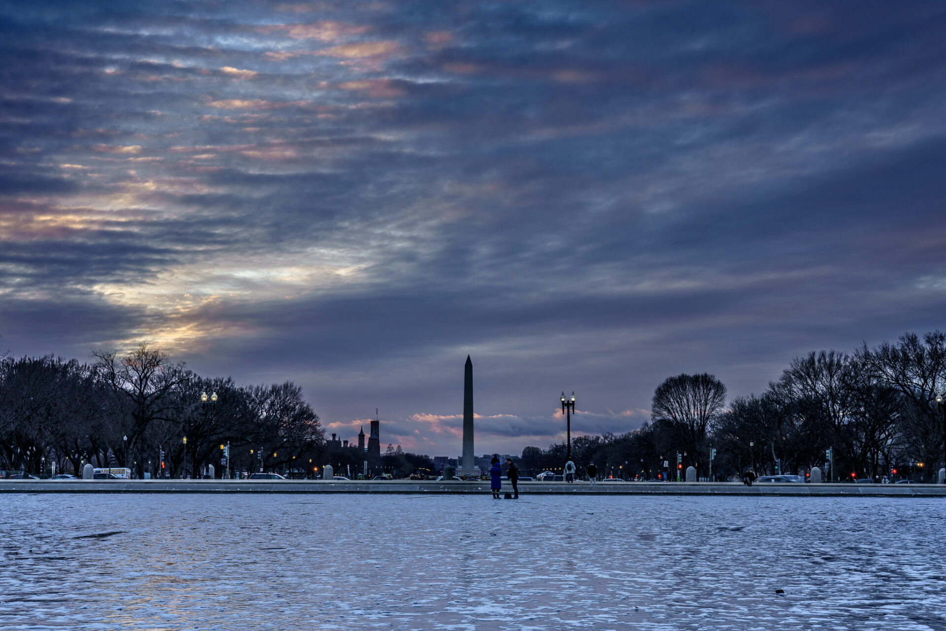 Vivid Pink Cloudy Sunset above Washington Monument and Icy Capitol Reflecting Pool