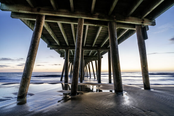 Watching Sunrise under the Pier at Virginia Beach