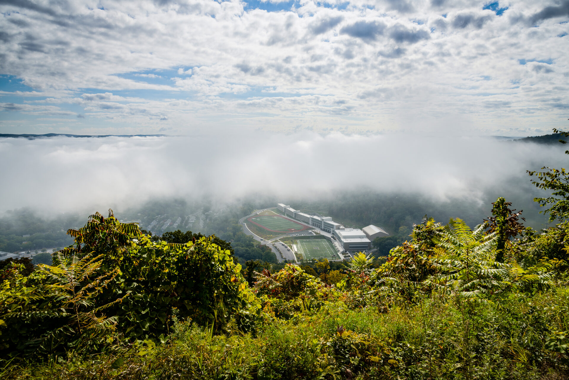 West Point football field in the cradle of clouds and fog