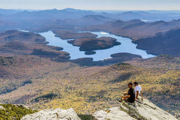 Hikers behold Lake Placid from atop Whiteface Mountain