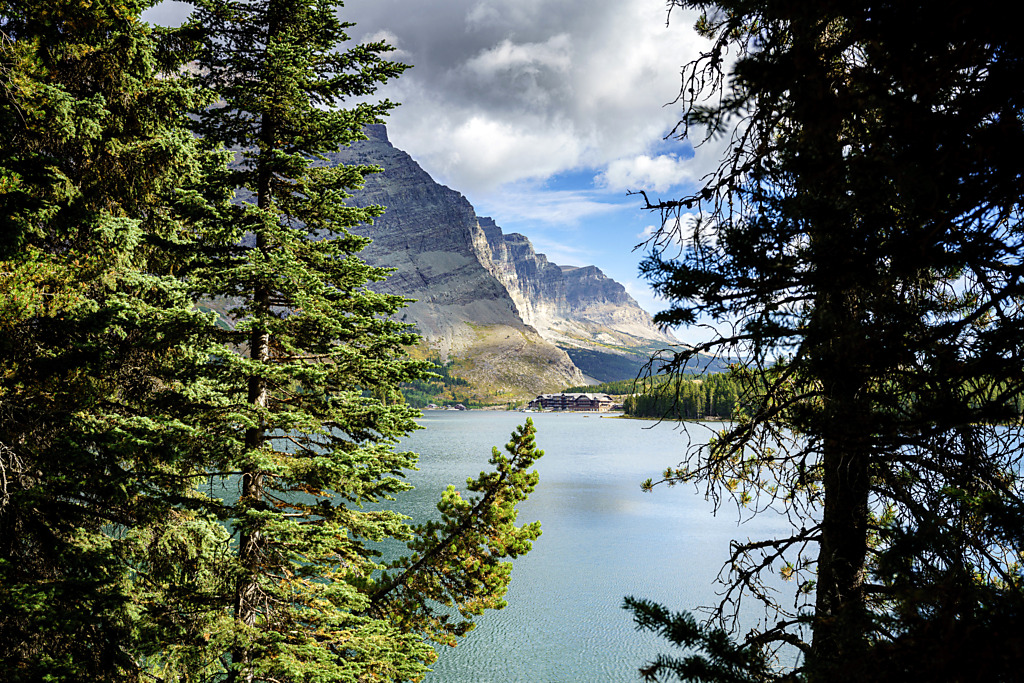Many Glacier Hotel Glimpsed Through Trees across Swiftcurrent Lake