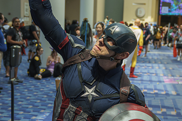 Captain America raises Thor's Hammer above his head at Otakon 2023